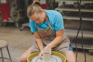 Person at the pottery wheel