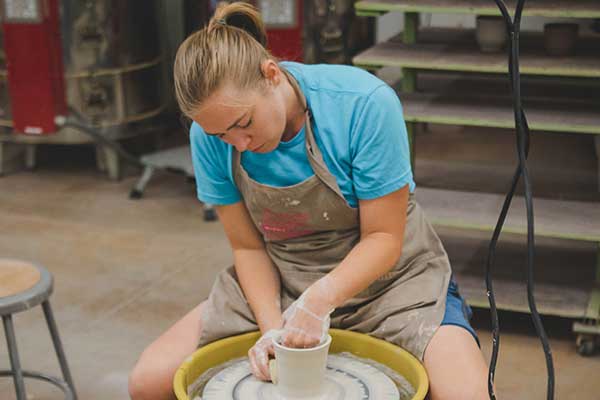 Person at the pottery wheel