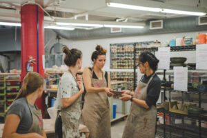 students in pottery classes