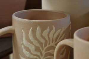 ceramic cup with plant design